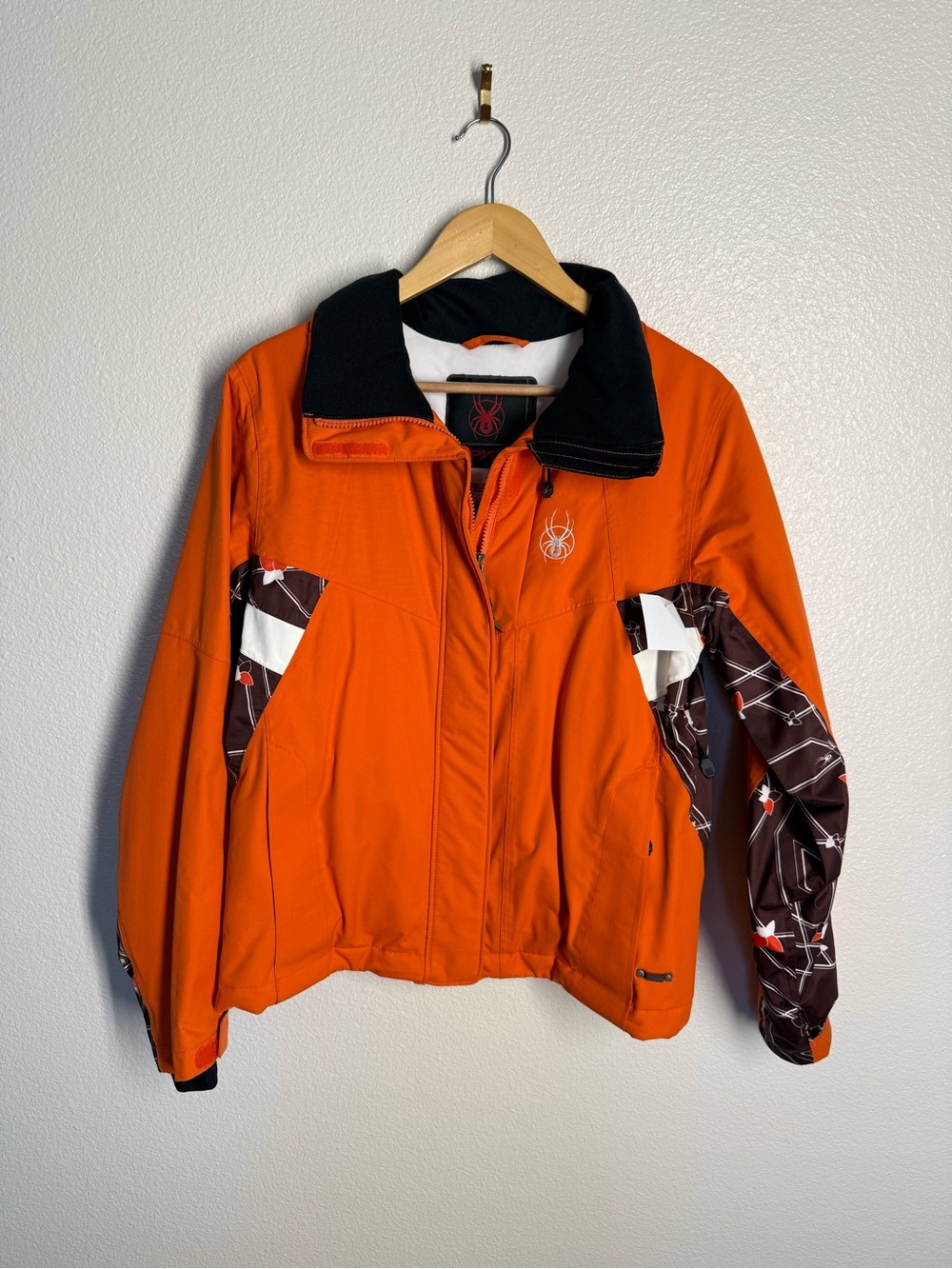 Spyder Orange Ski Jacket with Black Collar and Patterned Sleeves